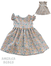 A100 15B VESTIDO PARA BEBA CON VOLADOS EN HOMBROS FONDO BLANCO ESTAMPADO FLORES DE COLORES TYG