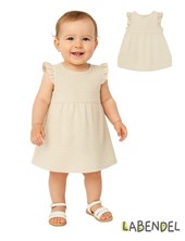 Vestido de jersey beige con pintitas blancas con volados.TYG