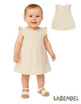 Vestido de jersey beige con pintitas blancas con volados.TYG
