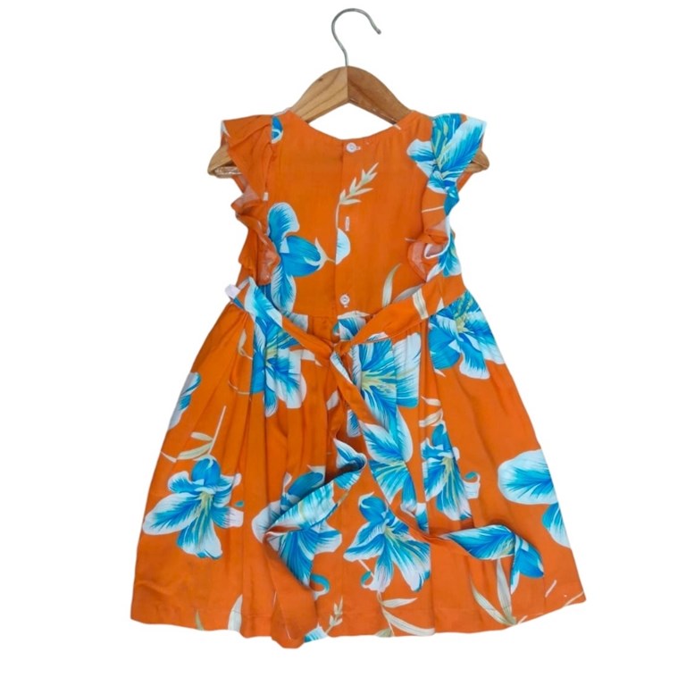 vestido de niña fibrana estampado flores con volados fondo naranja tyg