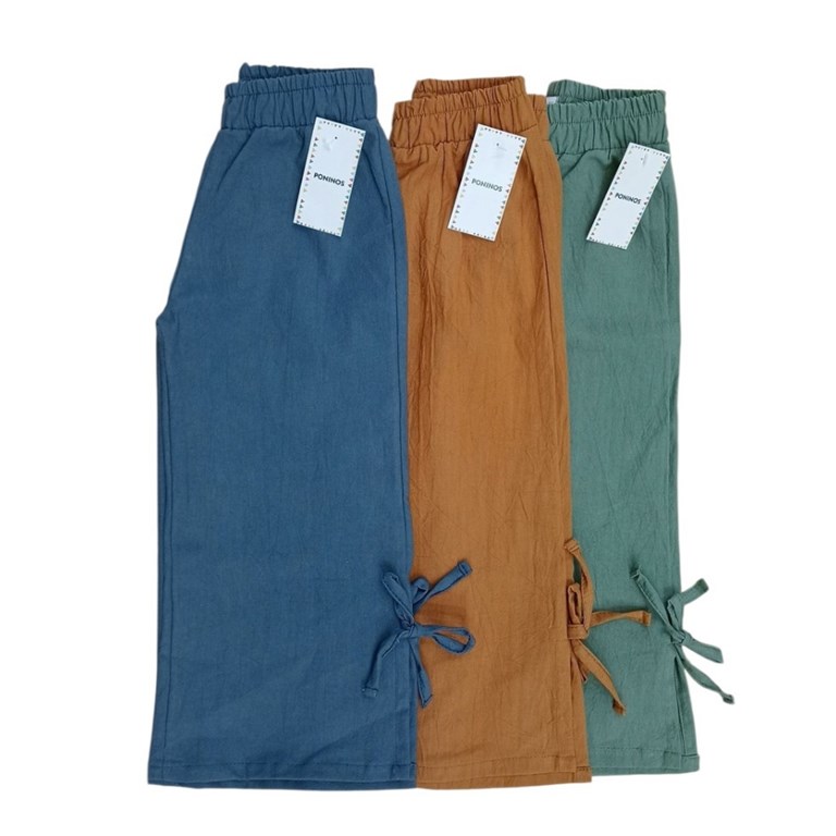 Pantalon de nena en tussor con tajo y moño.Poninos